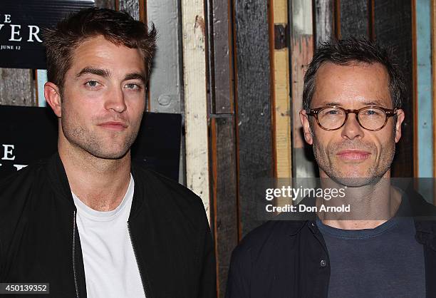 Robert Pattinson and Guy Pearce pose during a photo call for "The Rover" at Sydney Theatre on June 6, 2014 in Sydney, Australia.