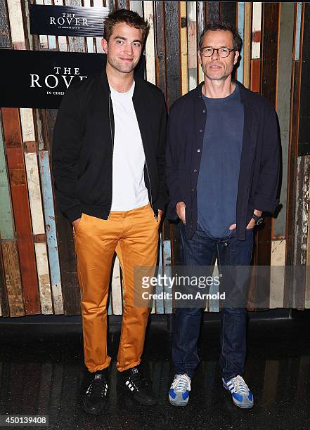 Robert Pattinson and Guy Pearce pose during a photo call for "The Rover" at Sydney Theatre on June 6, 2014 in Sydney, Australia.