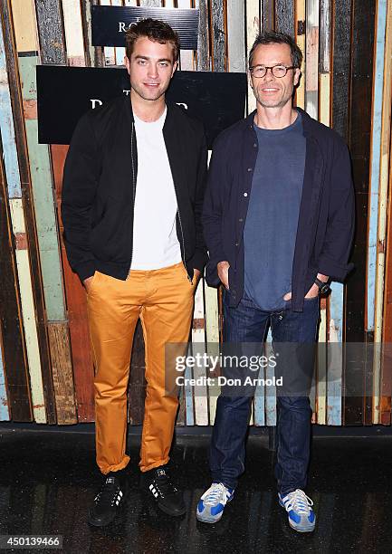 Robert Pattinson and Guy Pearce pose during a photo call for "The Rover" at Sydney Theatre on June 6, 2014 in Sydney, Australia.