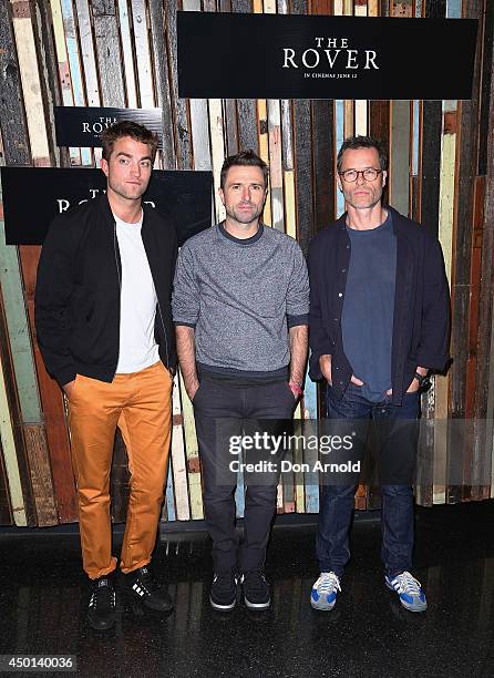 Robert Pattinson, David Michold and Guy Pearce pose during a photo call for "The Rover" at Sydney Theatre on June 6, 2014 in Sydney, Australia.