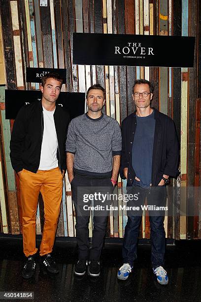 Robert Pattinson, David Michod and Guy Pearce attend a photo call for "The Rover" as part of the Sydney Film Festival at Sydney Theatre on June 6,...