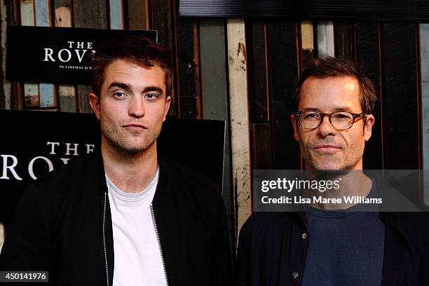 Robert Pattinson and Guy Pearce attend a photo call for "The Rover" as part of the Sydney Film Festival at Sydney Theatre on June 6, 2014 in Sydney,...