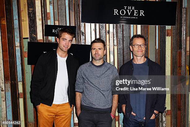 Robert Pattinson, David Michod and Guy Pearce attend a photo call for "The Rover" as part of the Sydney Film Festival at Sydney Theatre on June 6,...