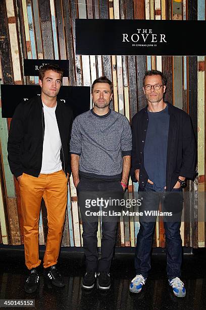 Robert Pattinson, David Michod and Guy Pearce attend a photo call for "The Rover" as part of the Sydney Film Festival at Sydney Theatre on June 6,...