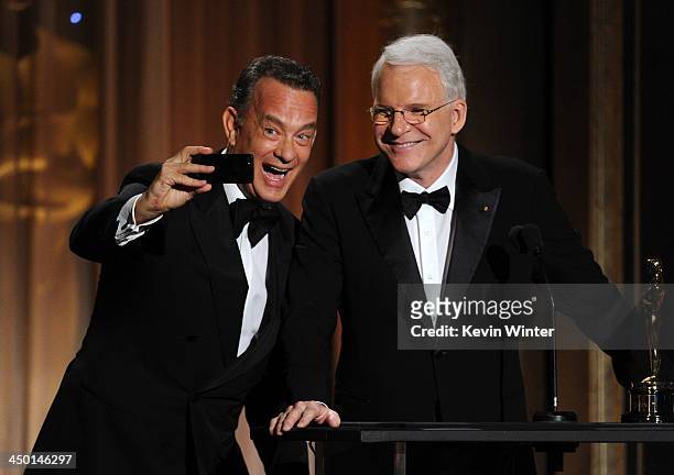 Actor Tom Hanks presents Honoree Steve Martin with honorary award onstage during the Academy of Motion Picture Arts and Sciences' Governors Awards at...