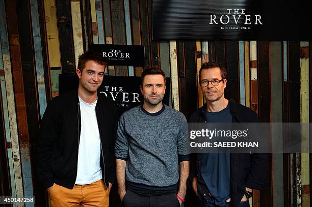 Actors Robert Pattinson , Guy Pearce and director David Michod pose during a photo call for their new movie 'The Rover' in Sydney on June 6, 2014....