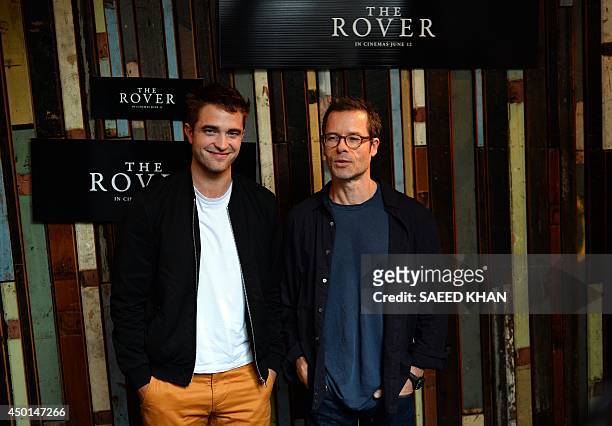 British actor Robert Pattinson and Guy Pearce pose during a photo call for their new movie 'The Rover' in Sydney on June 6, 2014. The Rover had its...