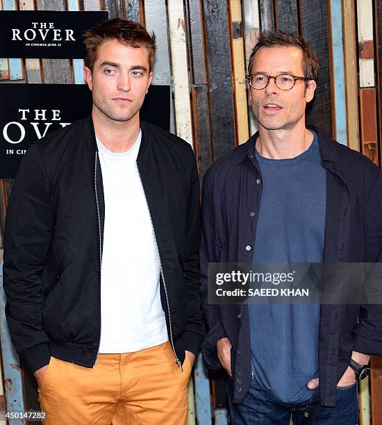 British actor Robert Pattinson and Guy Pearce pose during a photo call for their new movie 'The Rover' in Sydney on June 6, 2014. The Rover had its...