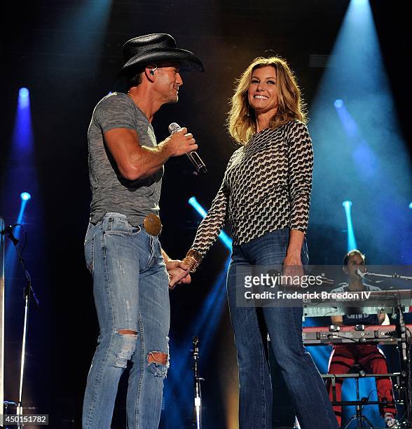Tim McGraw performs a duet with wife Faith Hill at LP Field at the 2014 CMA Festival on June 5, 2014 in Nashville, Tennessee.