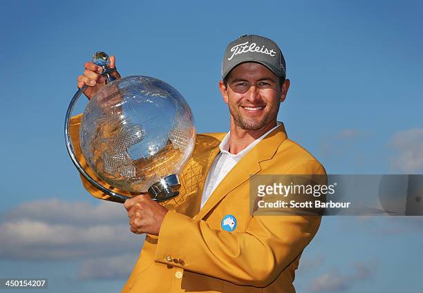 Adam Scott of Australia holds the trophy aloft after winning the tournament during round four of the 2013 Australian Masters at Royal Melbourne Golf...
