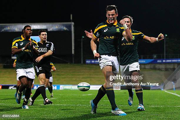 Jesse Kriel of South Africa celebrates after scoring a try during the 2014 Junior World Championships match between New Zealand and South Africa at...
