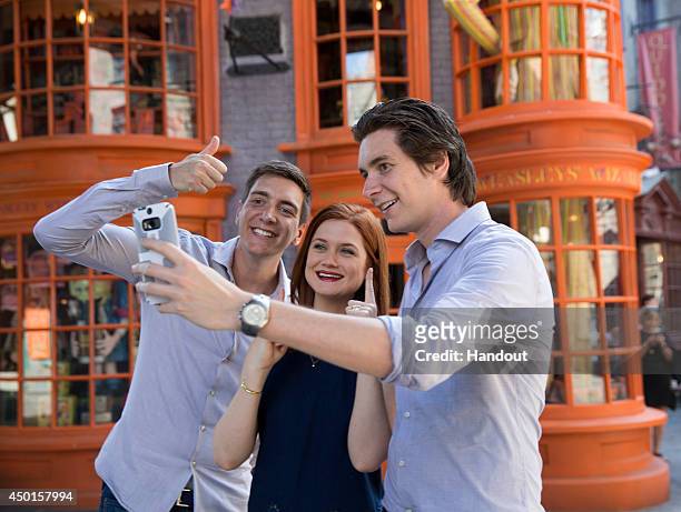 In this handout photo provided by Universal Orlando Resort, James Phelps, Bonnie Wright and Oliver Phelps from the popular Harry Potter film series...
