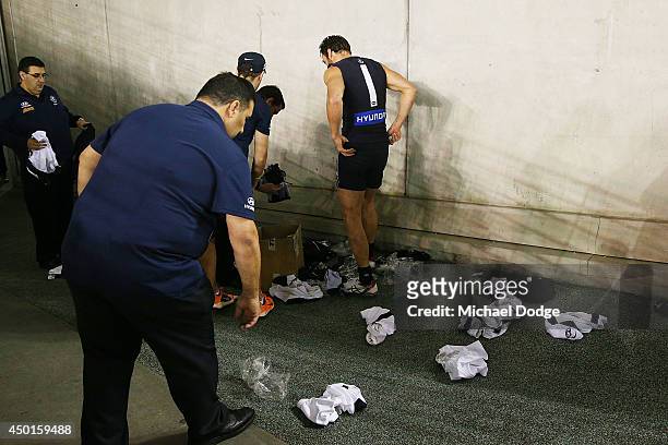 Andrew Walker of the Blues gets changed out of his white shorts and into the Blue shorts during the round 12 AFL match between the Geelong Cats and...
