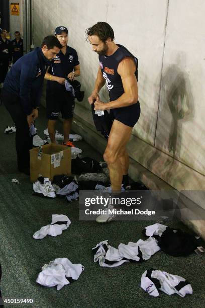 Andrew Walker of the Blues gets changed out of his white shorts and into the Blue shorts during the round 12 AFL match between the Geelong Cats and...