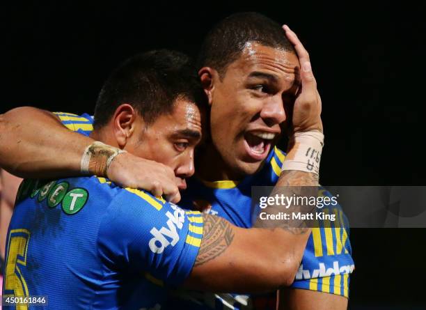 Ken Sio of the Eels celebrates with Will Hopoate after scoring a try during the round 13 NRL match between the Parramatta Eels and the North...