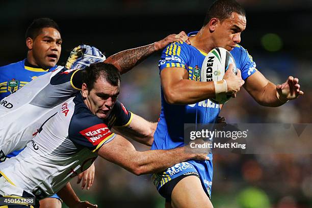 Will Hopoate of the Eels is tackled during the round 13 NRL match between the Parramatta Eels and the North Queensland Cowboys at Pirtek Stadium on...