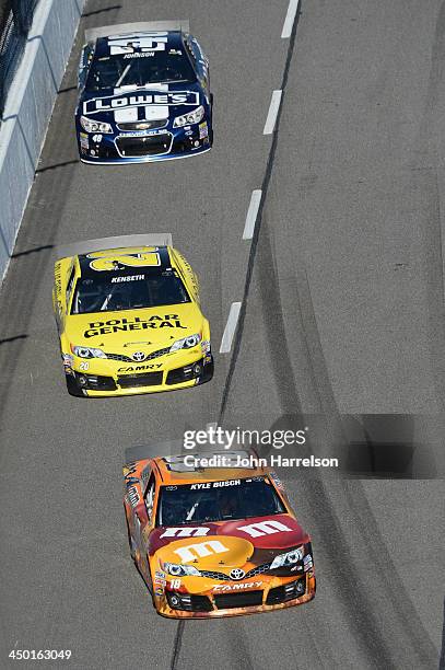 Kyle Busch, driver of the M&M's Halloween Toyota, Matt Kenseth, driver of the Dollar General Toyota, and Jimmie Johnson, driver of the Lowe's...