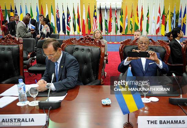Australian prime minister Tony Abbott and Bahamas prime minister, Perry Gladstone Christie attend the final working session of the Commonwealth Heads...