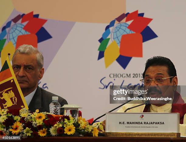 Sri Lankan President Mahinda Rajapaksa speaks to journalists as Commonwealth Secretary General Kamalesh Sharma looks during the press conferance on...