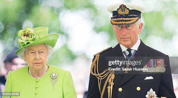 Queen Elizabeth II and Prince Charles, Prince of Wales attend a service at Bayeux Cemetary during D-Day 70 Commemorations on June 6, 2014 in Bayeux,...