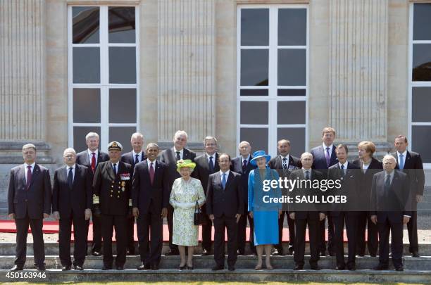 President Barack Obama participates in a group photo of world leaders attending the D-Day 70th Anniversary ceremonies at Chateau de Benouville in...