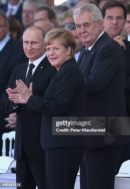 Russian President Vladimir Putin, German Chancellor Angel Merkel and Czech President Milos Zeman attend the International Ceremony at Sword Beach to...