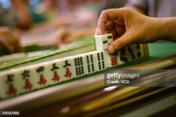 Participants compete during the 2014 World Mahjong Master Invitational Tournament on June 6, 2014 in Kunming, Yunnan Province of China. 143...