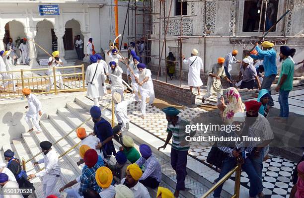 View of the clash between SGPC and members of a radical Sikh organisation on the occasion 30th anniversary of Operation Bluestar, at Golden Temple...