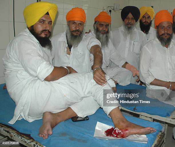 An injured SGPC employee after a clash between SGPC and members of a radical Sikh organisation on the occasion 30th anniversary of Operation...