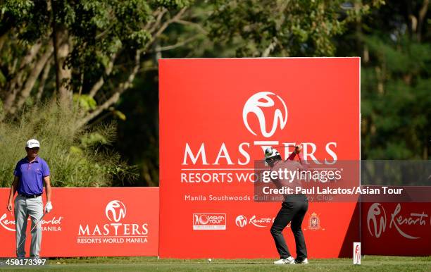 Liang Wen chong of China plays a shot during round four of the Resorts World Manila Masters at Manila Southwoods Golf and Country Club on November...