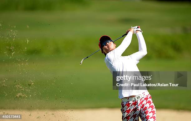 Jazz Janewattananond of Thailand plays a shot during round four of the Resorts World Manila Masters at Manila Southwoods Golf and Country Club on...