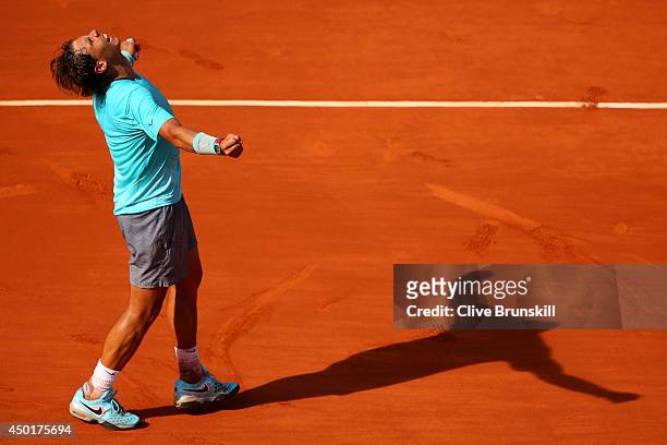 Rafael Nadal of Spain celebrates victory in his men's singles match against Andy Murray of Great Britain on day thirteen of the French Open at Roland...