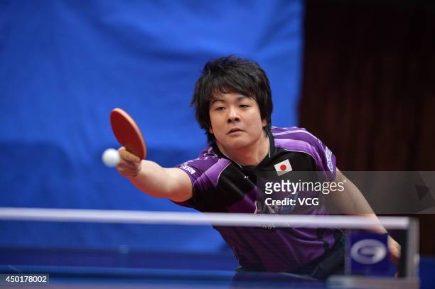 Seiya Kishikawa of Japan competes in his Men's Singles first round match against Liao Cheng-Ting of Chinese Taipei on day three of 2014 ITTF World...