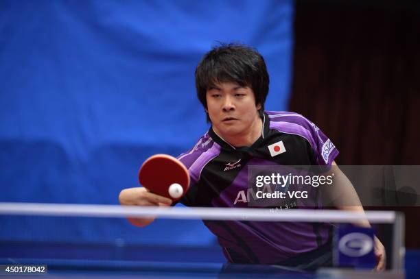 Seiya Kishikawa of Japan competes in his Men's Singles first round match against Liao Cheng-Ting of Chinese Taipei on day three of 2014 ITTF World...