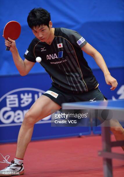 Yuto Muramatsu of Japan competes in his Men's Singles first round match against Chen Chien-An of Chinese Taipei on day three of 2014 ITTF World Tour...