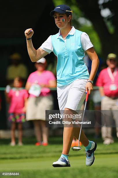 Georgia Hall of Great Britain and Ireland reacts after sinking her putt on the 11th hole during the 38th Curtis Cup match at the St. Louis Country...