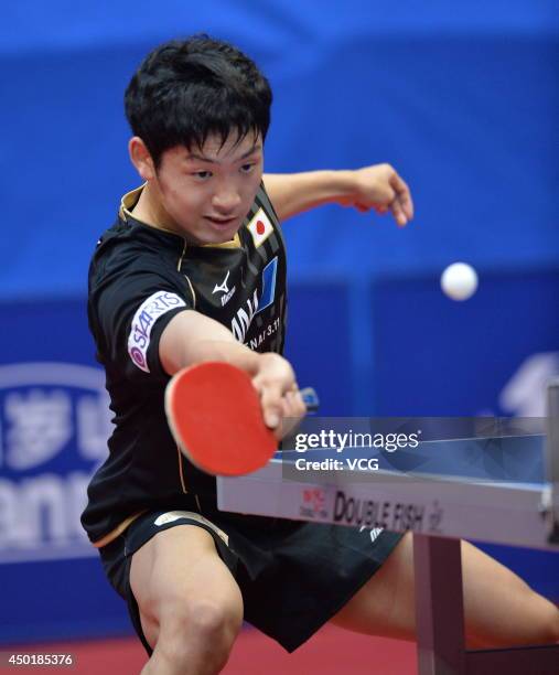 Yuto Muramatsu of Japan competes in his Men's Singles first round match against Chen Chien-An of Chinese Taipei on day three of 2014 ITTF World Tour...