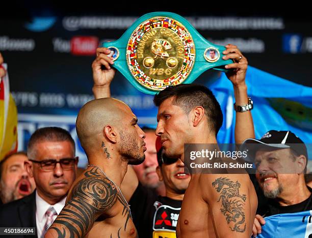 Miguel Cotto and Sergio Martinez stare each other down after their weigh in on June 6, 2014 in New York City. The two will be fighting for the WBC...