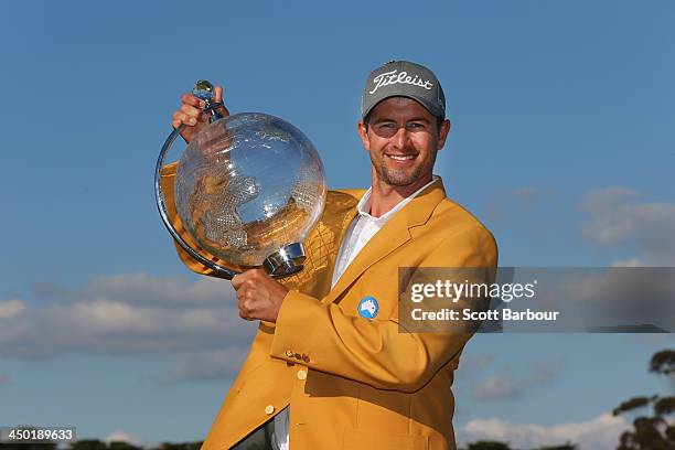 Adam Scott of Australia holds the trophy aloft after winning the tournament during round four of the 2013 Australian Masters at Royal Melbourne Golf...