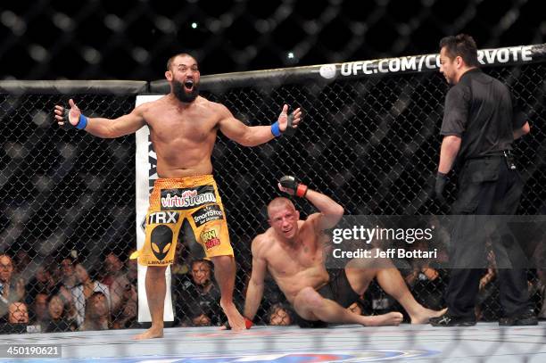 Johny Hendricks reacts after the end of his fight with Georges St-Pierre in their UFC welterweight championship bout during the UFC 167 event at the...