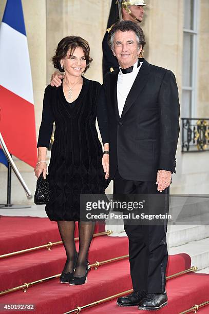 Jack Lang and his wife Monique Lang arrive at the Elysee Palace for a State dinner in honor of Queen Elizabeth II, hosted by French President...