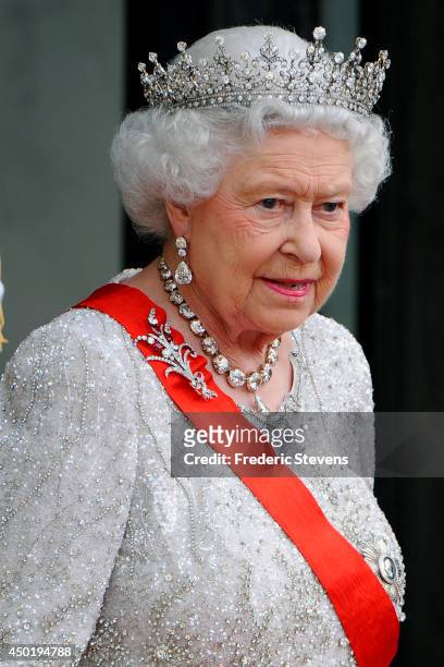 Queen Elizabeth II arrives at the Elysee Palace for a State dinner in honor of Queen Elizabeth II, hosted by French President Francois Hollande as...