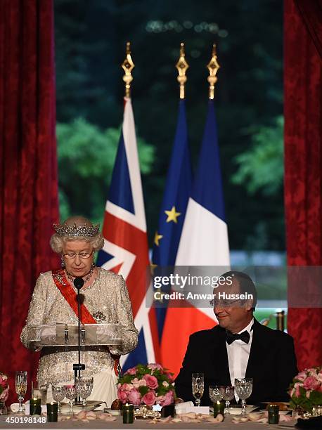 Queen Elizabeth ll delivers a speech during a State Banquet hosted by French President Francois Hollande at the Elysee Palace on June 6, 2014 in...