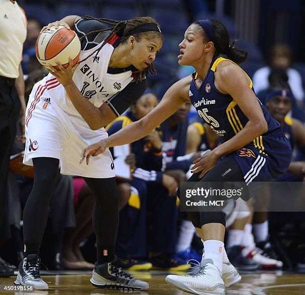 Washington Mystics guard Tierra Ruffin-Pratt protects the ball from Indiana Fever forward Marissa Coleman in the second quarter at the Verizon Center...