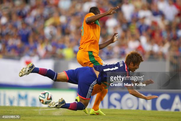 Yoichiro Kakitani of Japan is fouled by Stoppila Sunzu of Zambia during the International Friendly Match between Japan and Zambia at Raymond James...