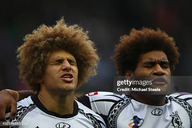 Eloni Vunakece and Vitale Junior Roqica of Fiji sing the national anthem during the Rugby League World Cup Quarter Final match between Samoa and Fiji...