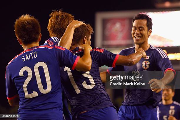Yoshito Okubo of Japan celebrates with his team after scoring a goal during the International Friendly Match between Japan and Zambia at Raymond...