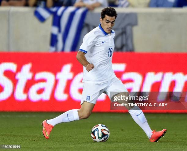 Greece Lazaros Christodoulopoulos moves the ball against Bolivia during an international friendly match at Red Bull Arena on June 6, 2014 in...