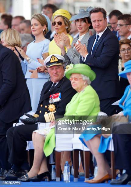 Queen Mathilde of Belgium, Queen Maxima of The Netherlands, Samantha Cameron and British Prime Minister David Cameron stand behind King Harald of...