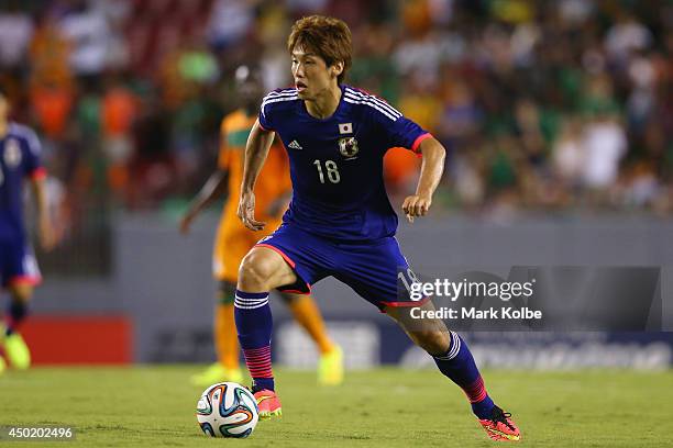 Yuya Osako of Japan runs with the ball during the International Friendly Match between Japan and Zambia at Raymond James Stadium on June 6, 2014 in...